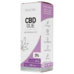 eine schachtel mit cbd-öl, die auf einem tisch steht.